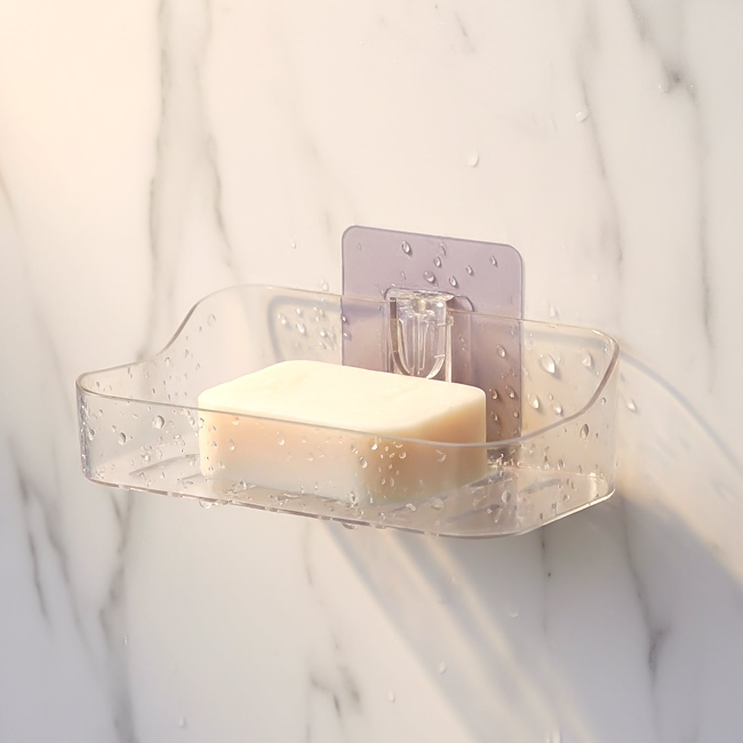 Two clear plastic transparent soap holders side by side for bathroom storage