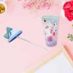 Close-up of the glittery design and the charming unicorn toy on top of the bottle.