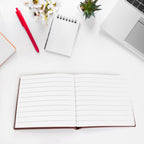 Chocolate scented notebook with a pen, ready for creative writing.