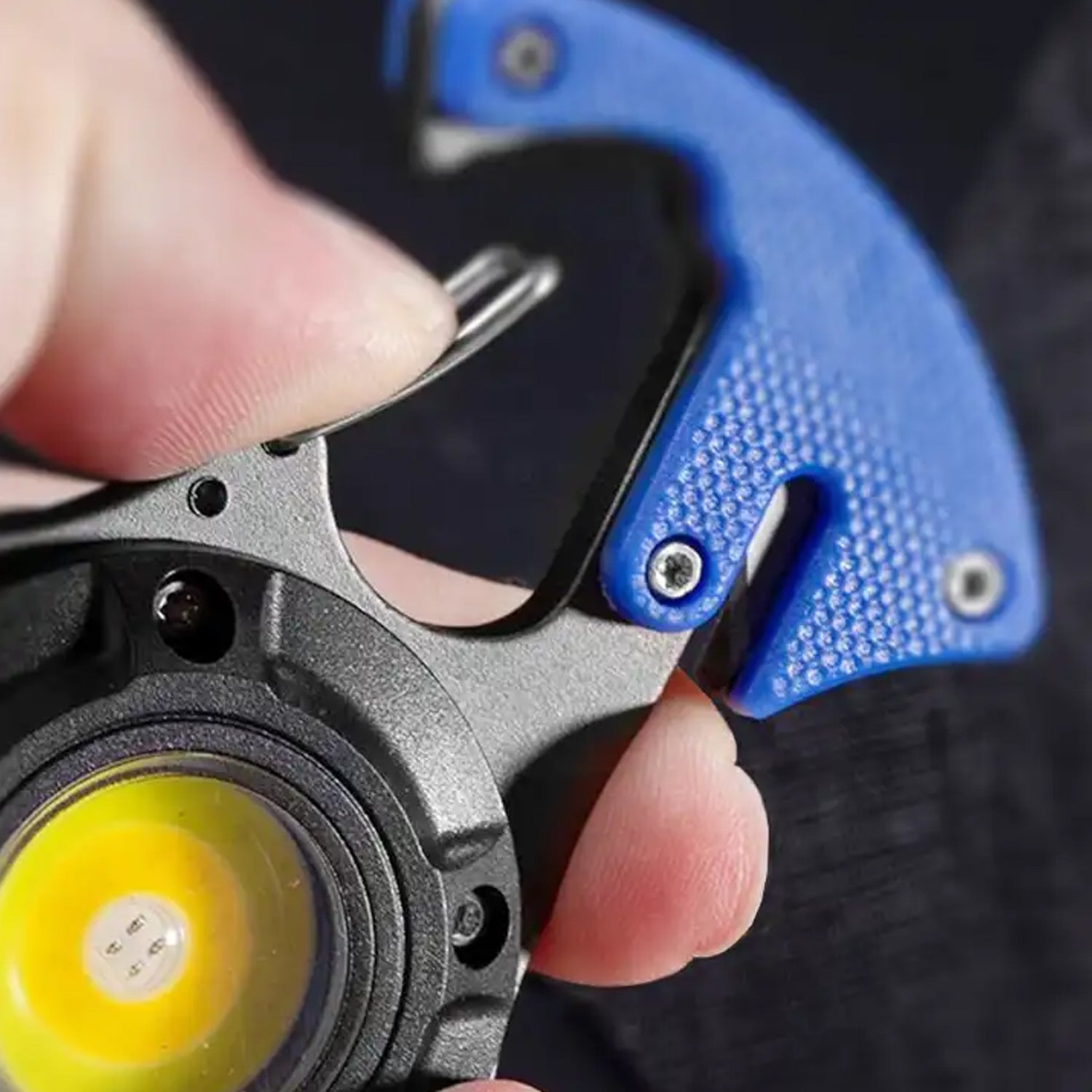 Close-up view of the rechargeable LED keychain flashlight powerfully illuminating a dark area.