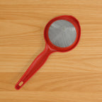 Green tea strainer with stainless steel mesh and fresh mint leaves
