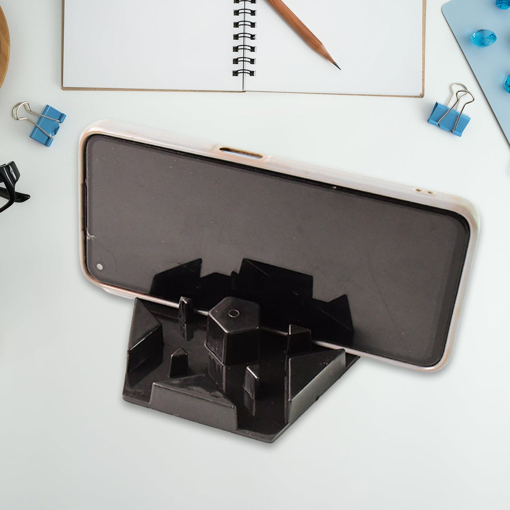 Multi-angle hexagonal plastic mobile phone stand positioned on desk