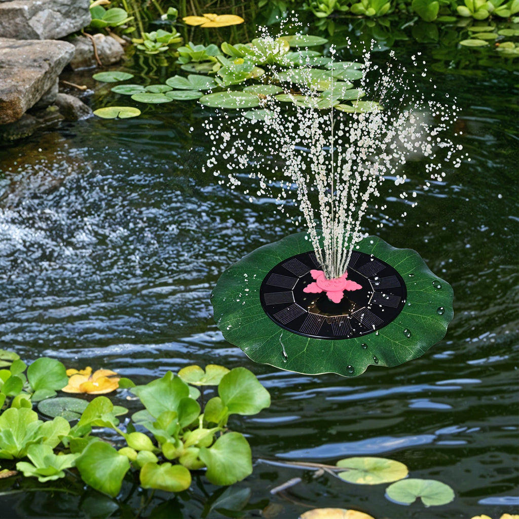 Decorative solar-powered floating water fountain pump placed on water surface