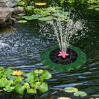 Decorative solar-powered floating water fountain pump placed on water surface
