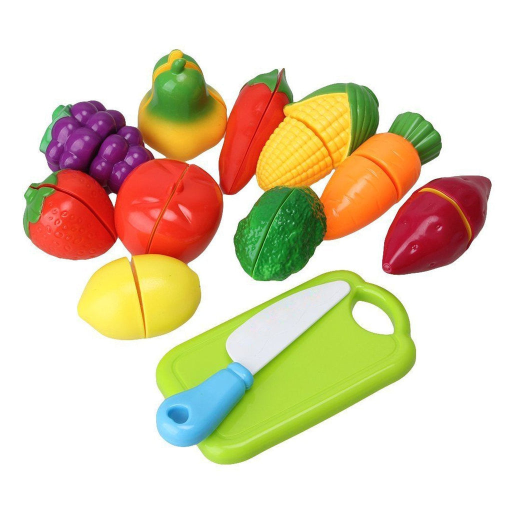Child's hands demonstrating how to "slice" a plastic fruit from the educational play food set.