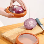 A transparent fruit and vegetable keeper with a green lid, showcasing fresh produce.