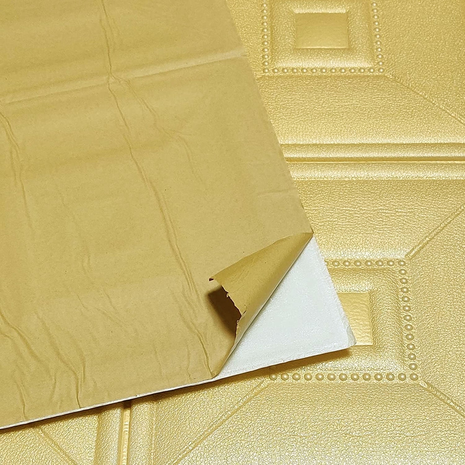 View of a single foam wallpaper sticker demonstrating its texture.