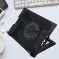 Sleek black laptop cooling pad with fan and adjustable stand, ready for use.