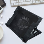 Sleek black laptop cooling pad with fan and adjustable stand, ready for use.