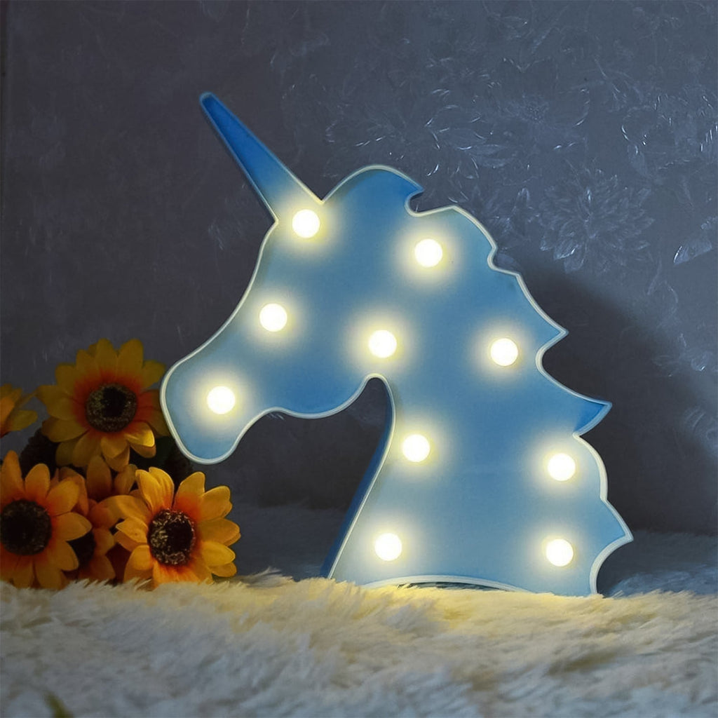 Pink unicorn themed decorative night light illuminating softly