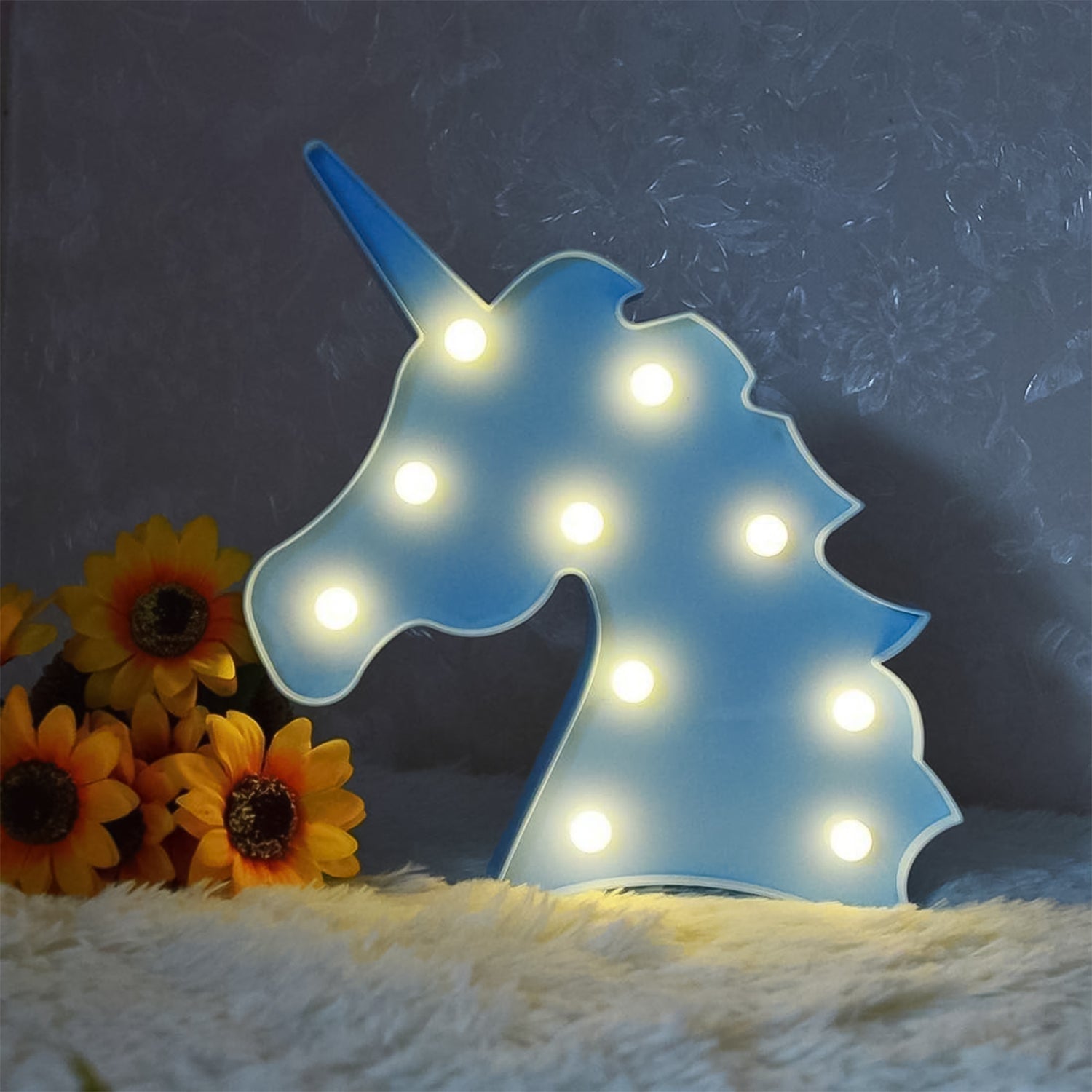 Pink unicorn themed decorative night light illuminating softly