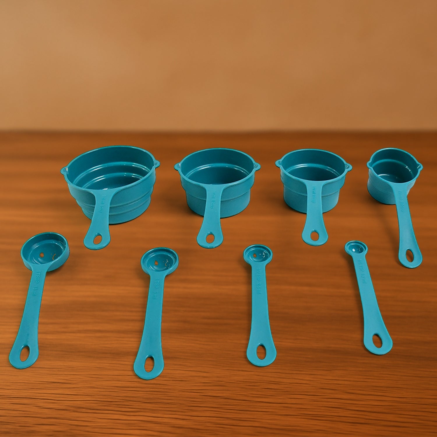 Apex measuring cups and spoons laid out for cooking use