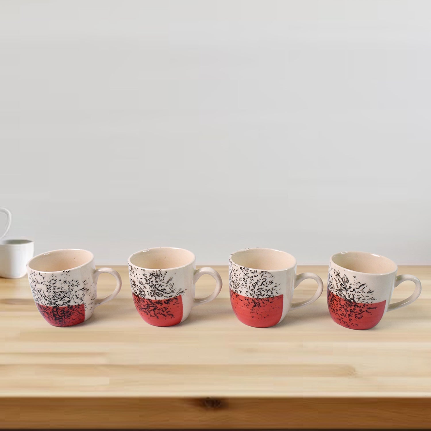 Top view of ceramic cups and glass bowls in 9-piece set