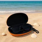 The black zipper sunglasses case shown closed from a slight angle, highlighting its sleek exterior.