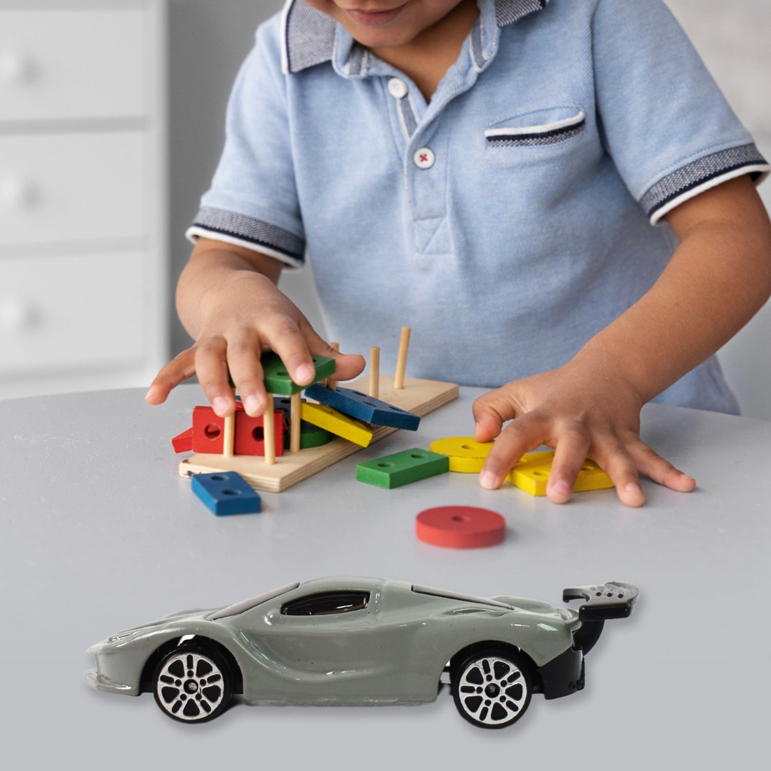 Side angle view of a Die-Cast Metal Mini Car Toy with free wheels