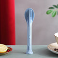 A complete 3-in-1 reusable cutlery set, featuring a spoon, fork, and knife, neatly arranged for travel.