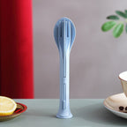 A complete 3-in-1 reusable cutlery set, featuring a spoon, fork, and knife, neatly arranged for travel.