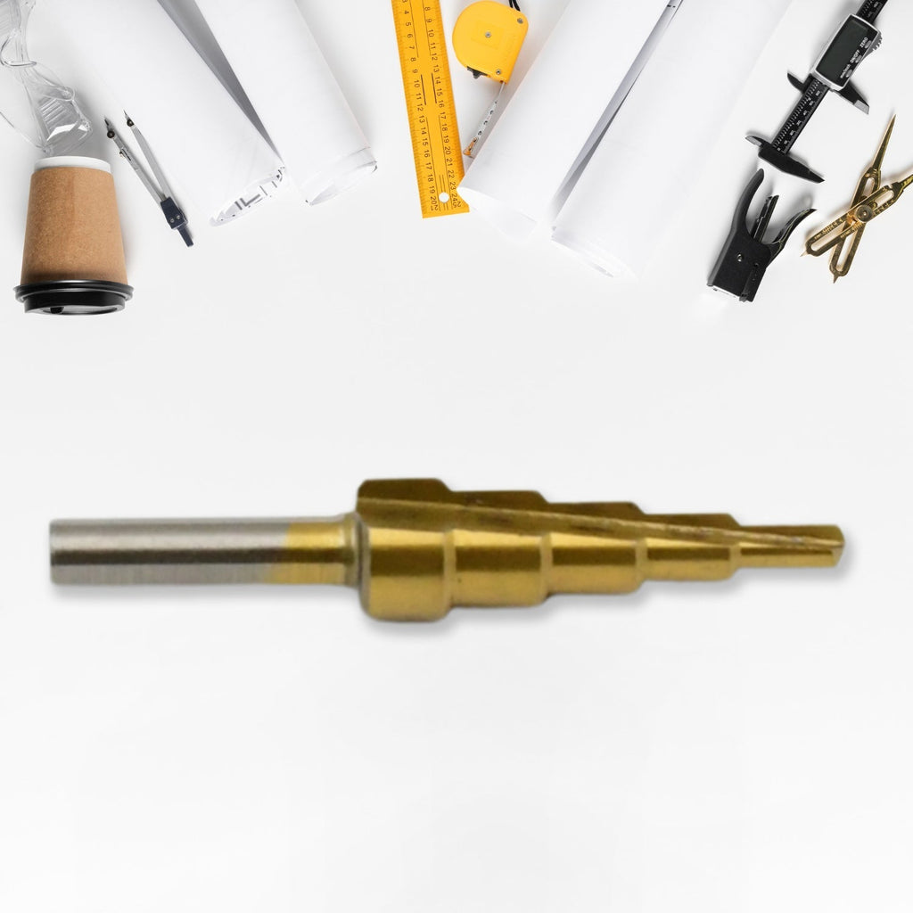 The versatile Step Drill Bit by Wagtail shown against a blurred workshop background.