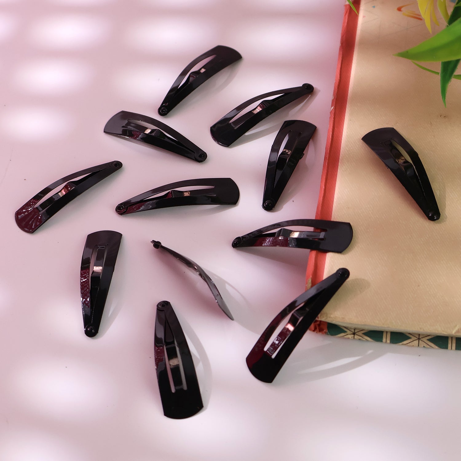 Twelve Matt Black Metal Hair Clips neatly arranged on a clean white background.