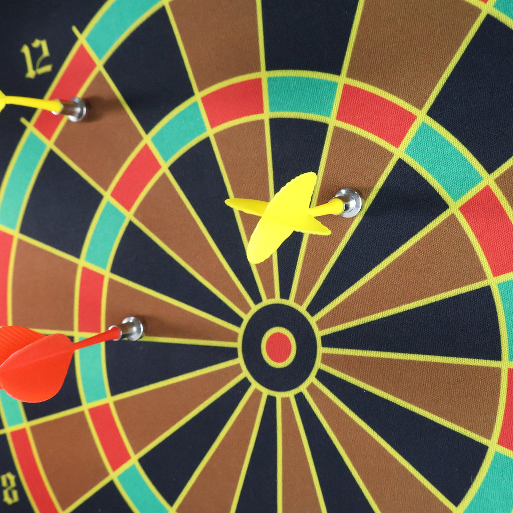 Roll-up dartboard showing stitched edge and rigid rod for flat stability