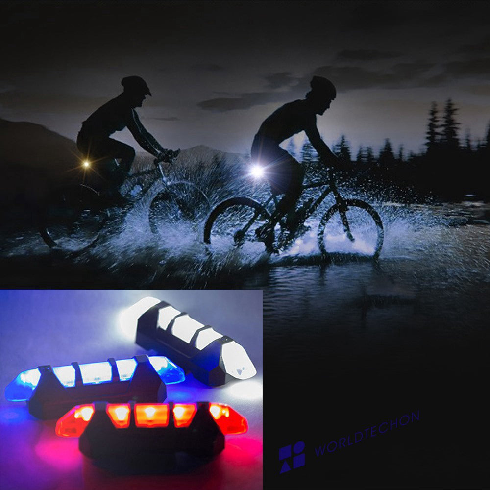 Close-up of a blue rechargeable bicycle front light mounted on handlebars, showing its sleek design.