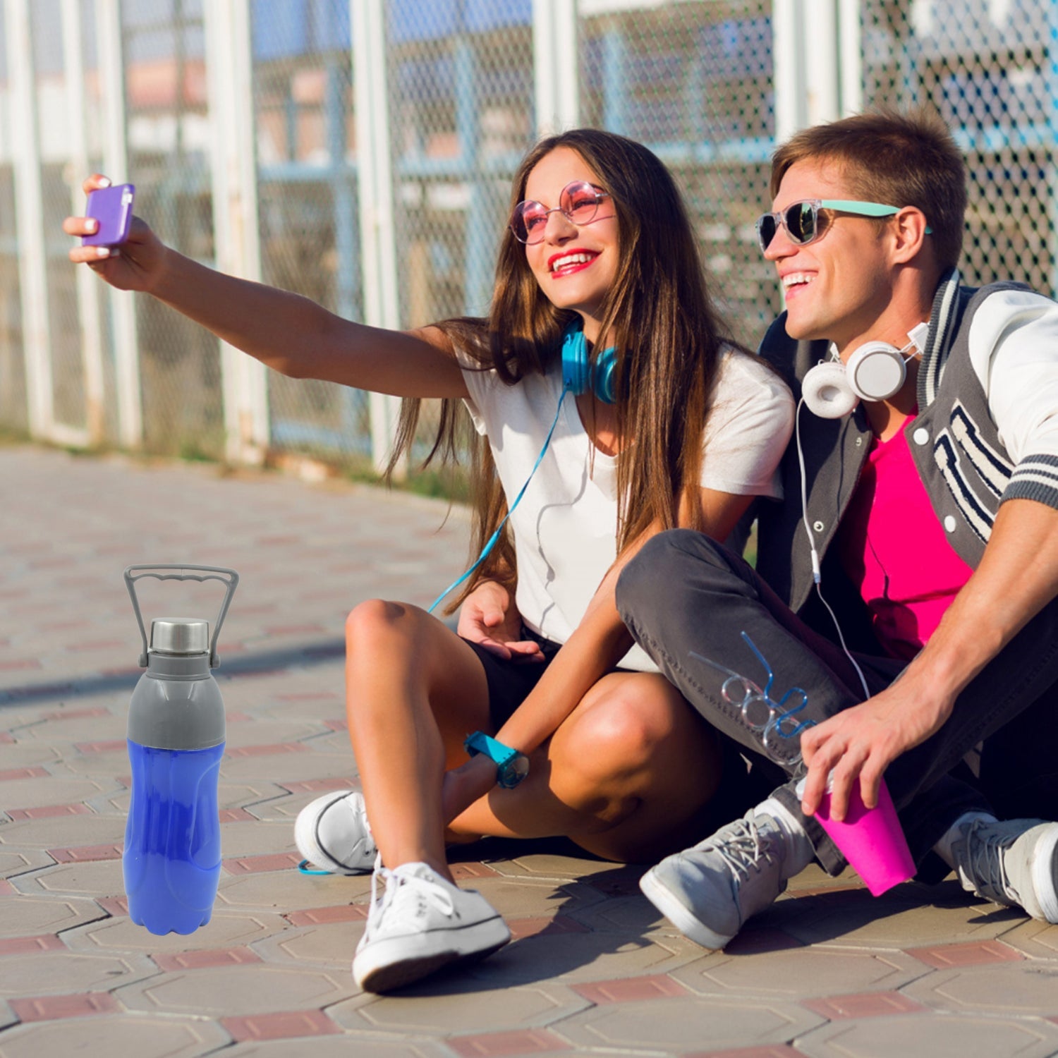Person holding a mixed-color BPA-Free water bottle for on-the-go hydration.