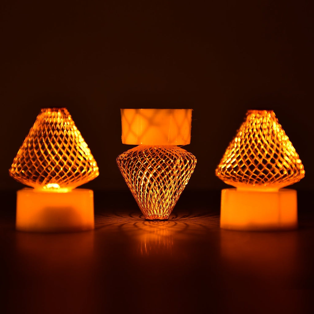 A close-up view of multiple Flameless LED Tea Light Candles glowing warmly on a dark surface.