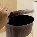 Hygienic mini pedal dustbin with its lid open, showcasing ample space.
