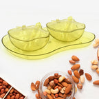 Apple-shaped plastic serving tray filled with assorted snacks.