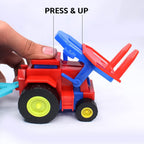 Friction tractor toy with its red trolley loaded with colorful toy bricks, on a plain surface.