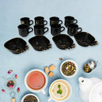 Elegant ceramic tea cups and pineapple-shaped plastic serving bowls.