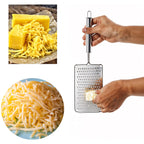 Side view of stainless steel vegetable grater featuring ergonomic handle