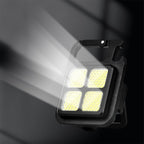 Mini LED keychain light illuminating a path during an outdoor activity.