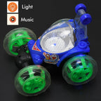 A child's hand holding the remote control next to the colourful rechargeable RC car.