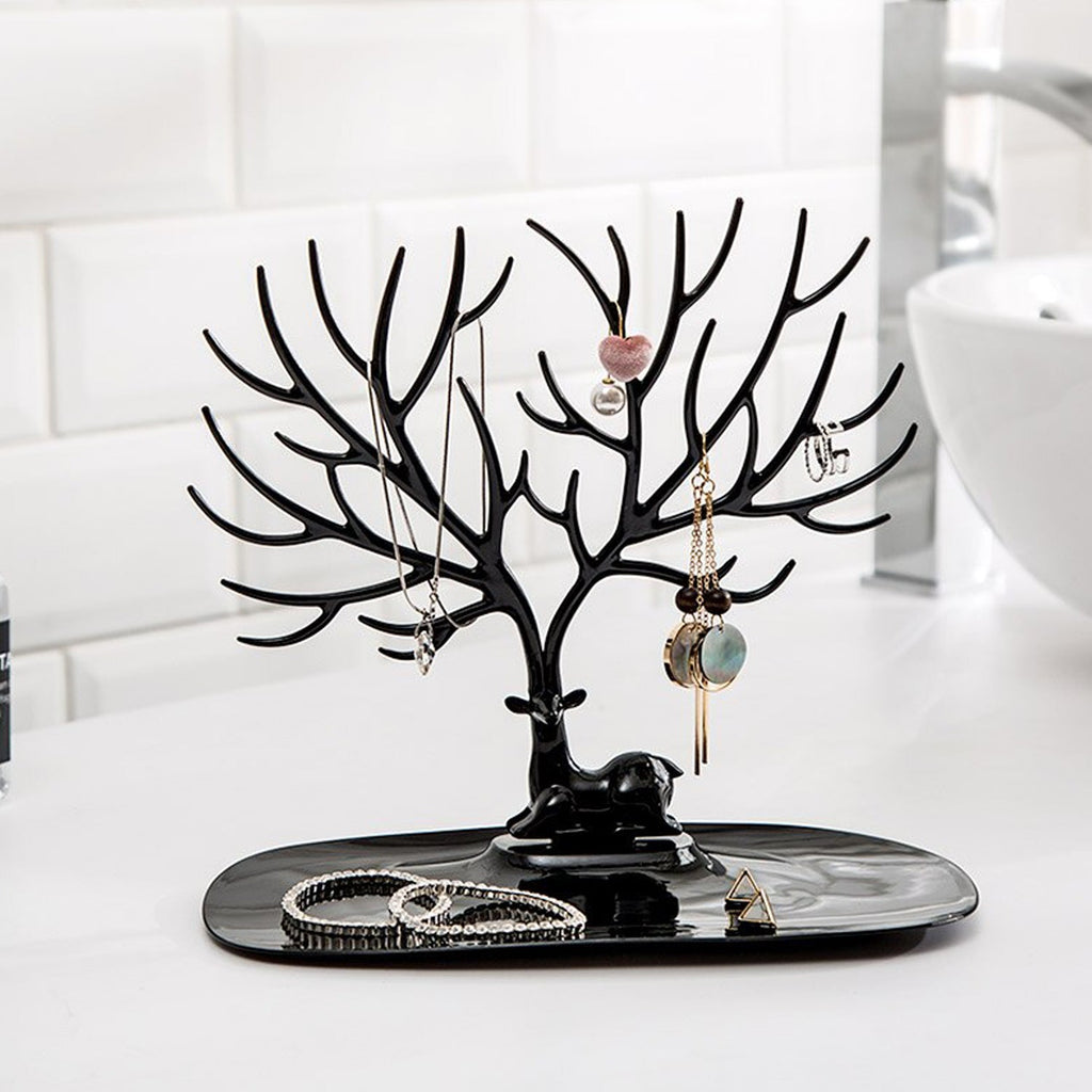 Side view of deer shaped jewellery holder showcasing antler branches and oval tray