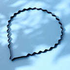 Close-up of metal wavy hairband with anti-slip flexible design