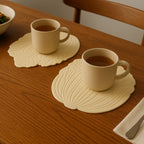 Elegant silicone leaf coaster set protecting a wooden table