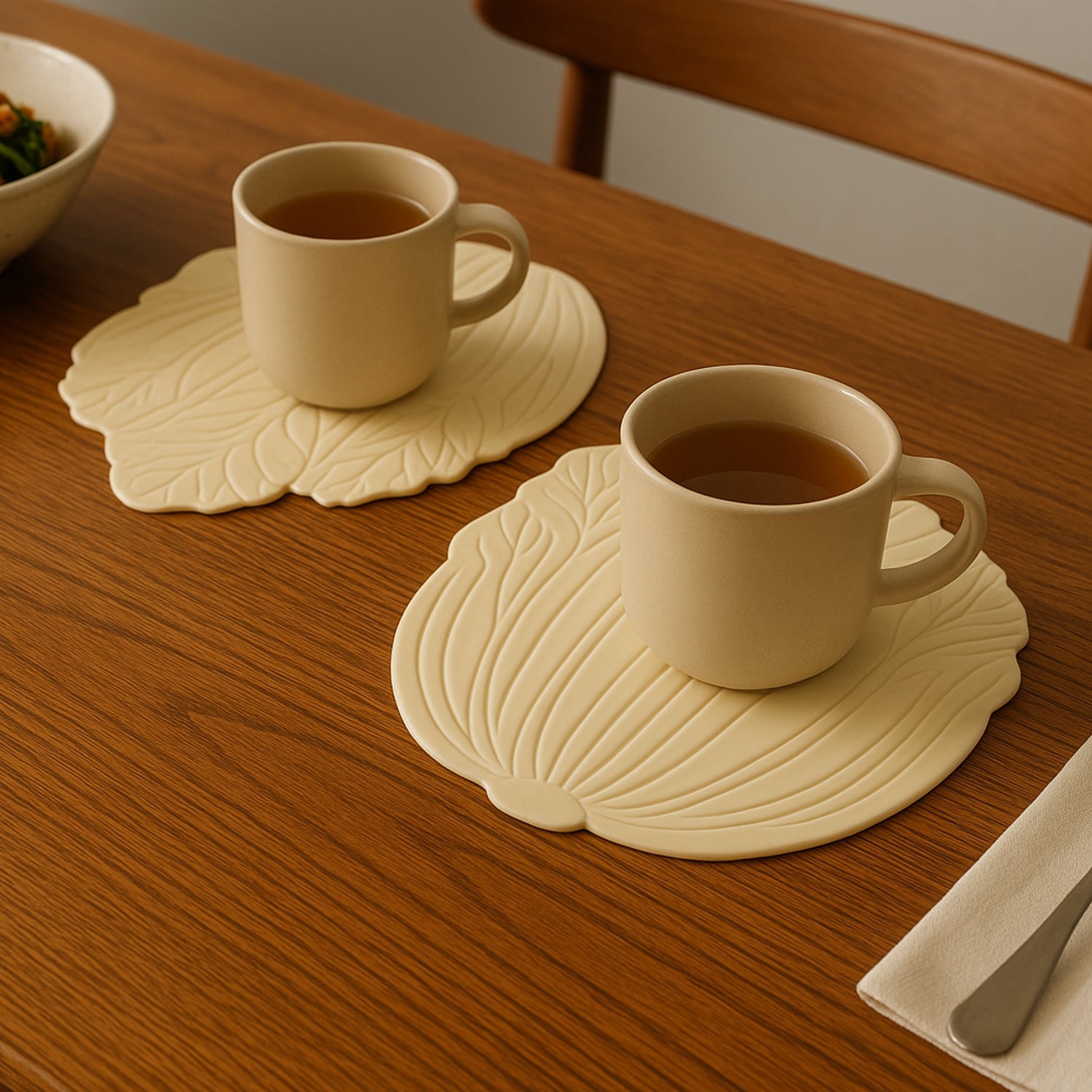 Elegant silicone leaf coaster set protecting a wooden table