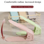 A folding shoe slot organizer demonstrating its adjustable height feature for different shoe types.