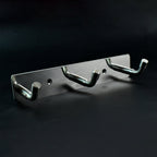 Polished metallic 3 hook rack mounted on bedroom wall
