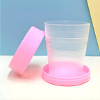 A close-up of the lightweight folding travel cup, highlighting its portable design.