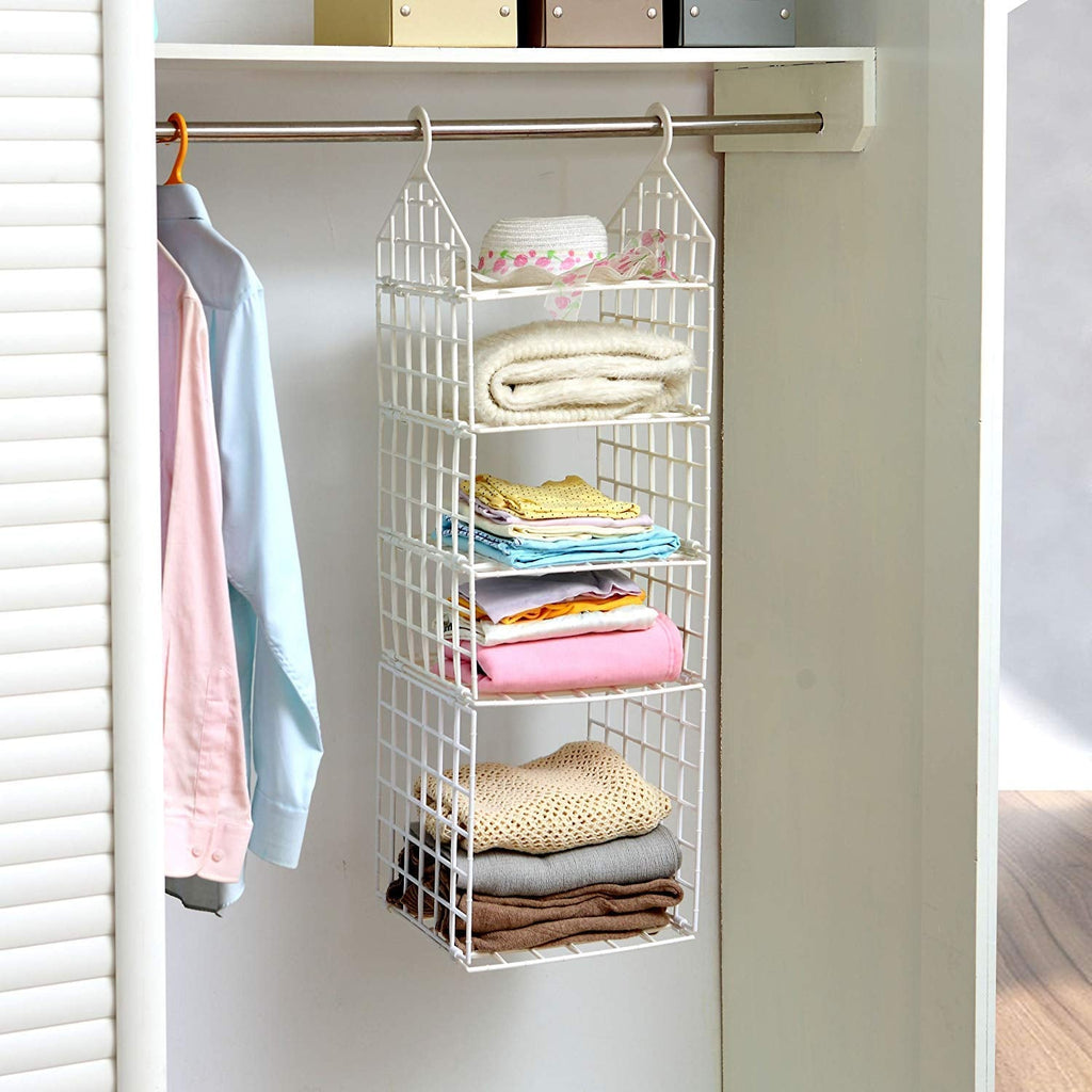 Various clothes, including pants and shirts, neatly hung on the different tiers of the folding clothes hanger.