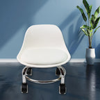 Low height rolling stool with wheels featuring a comfortable PU leather seat and sturdy base.