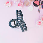 Close-up of matte plastic hair barrette clamp open