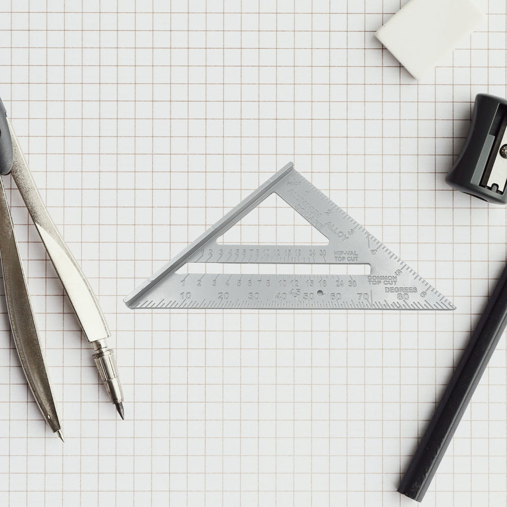A carpenter using the versatile 45-degree triangle ruler for framing, ensuring accurate cuts.