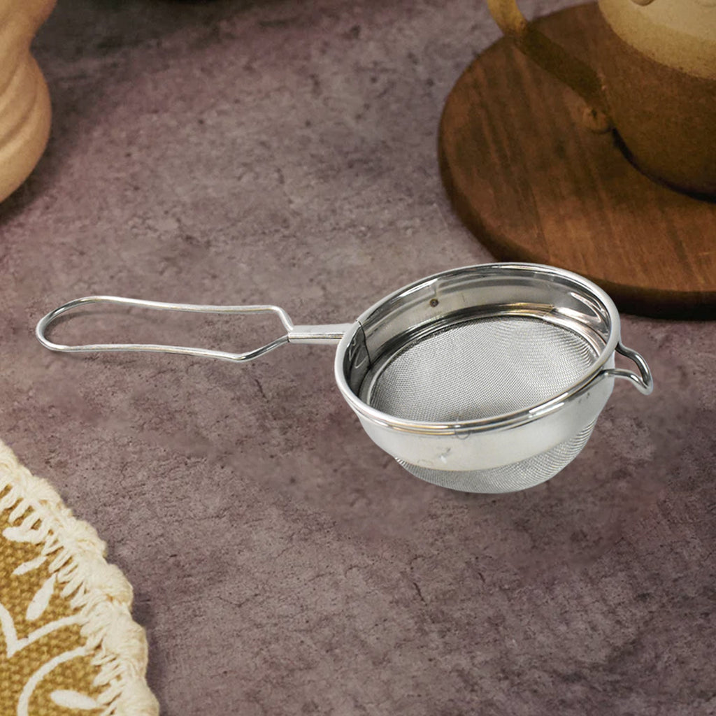 Side profile of stainless steel tea strainer showcasing mesh and rim