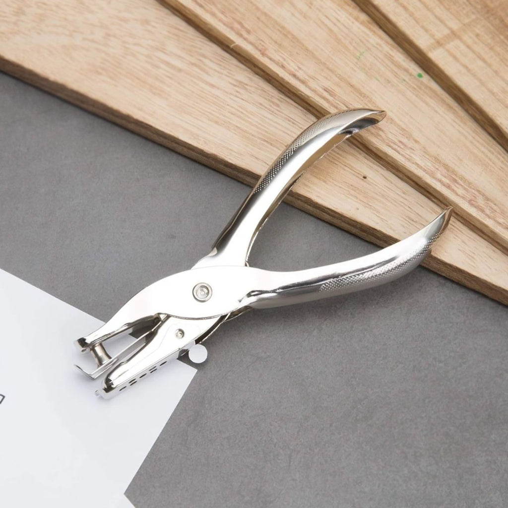 Shiny chrome-plated single hole paper puncher, highlighting its premium finish.