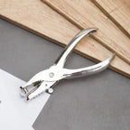 Shiny chrome-plated single hole paper puncher, highlighting its premium finish.
