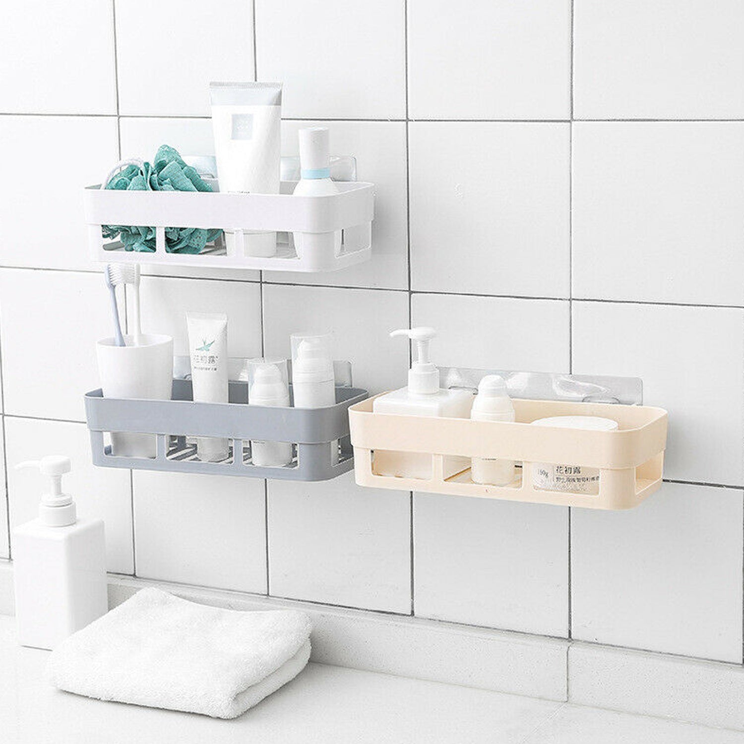 Wall-mounted shower shelf neatly holds toiletries in a bathroom corner.