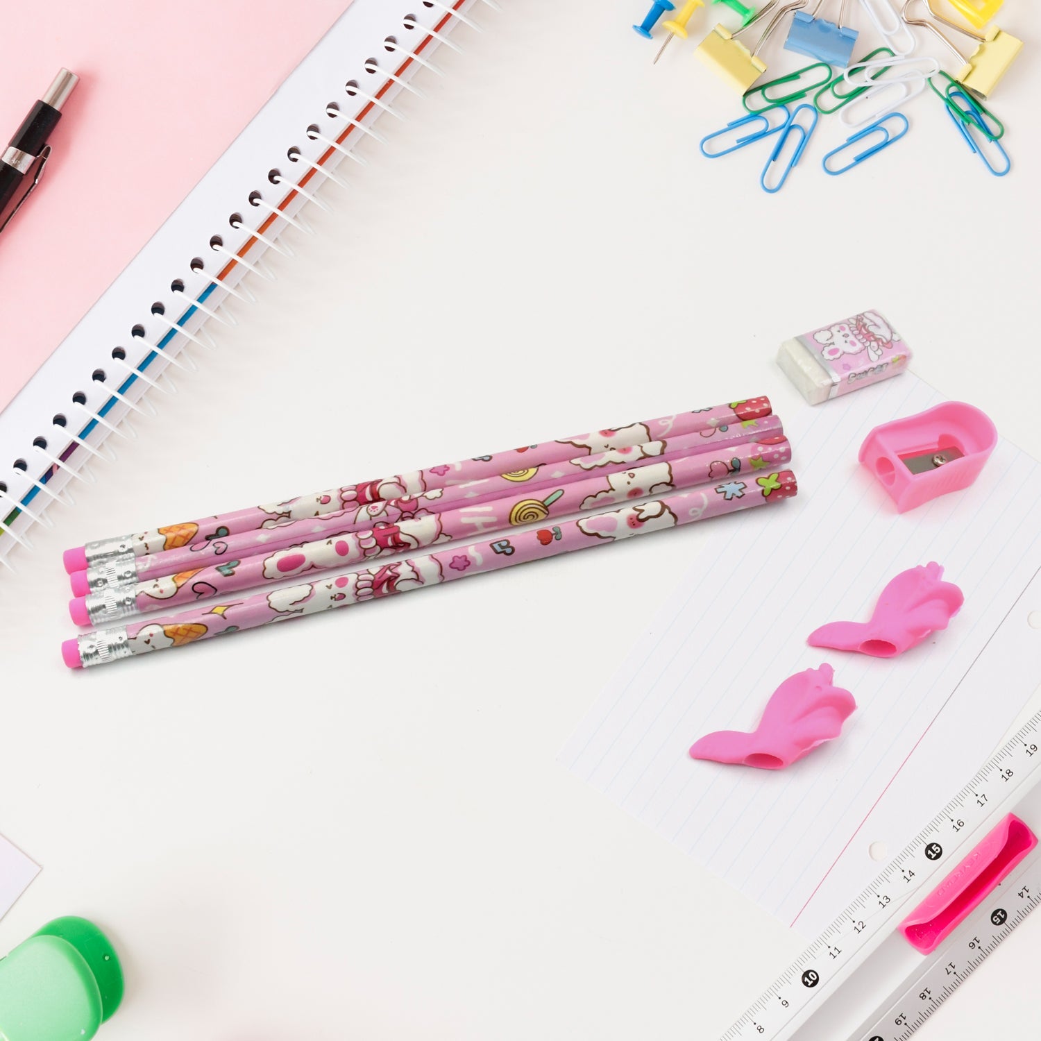 Vibrant erasers and a sharpener included in the kids' stationery kit.